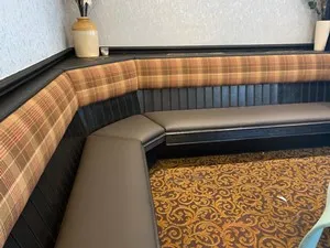 Corner sofa seating recovered with new fabric
