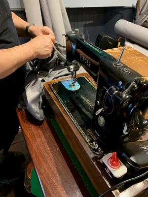 The original Singer sewing machine in our Stalybridge workshop — still the daily driver after decades