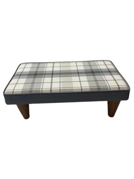 Tartan-covered pouffe