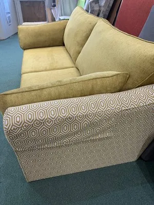 Two-tone settee reupholstered with contrasting fabrics
