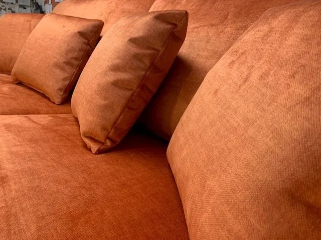 Bright orange three-piece suite reupholstered