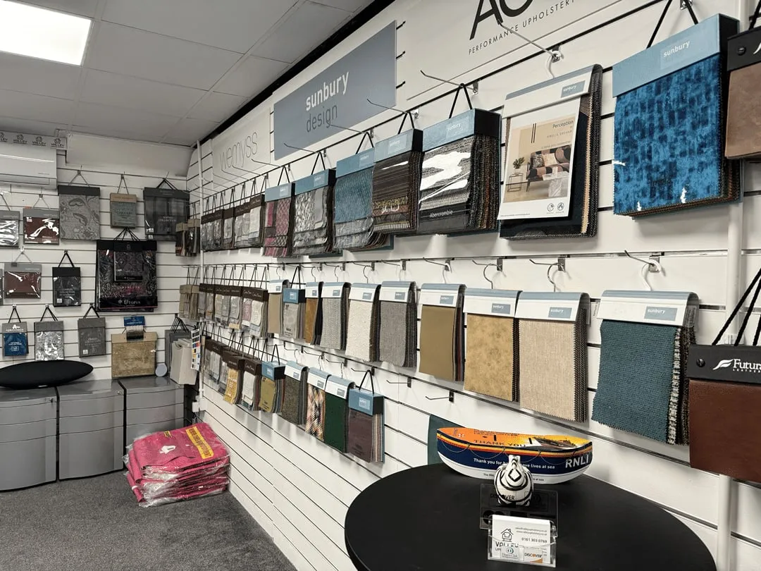 The fabric showroom wall at our Stalybridge shop — hundreds of fabrics from twelve suppliers