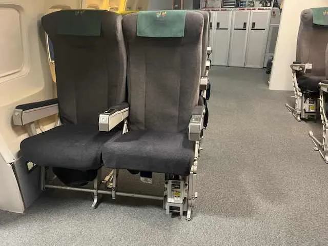 Boeing 747 cabin crew training seats recovered for Tameside College, fitted with embroidered college antimacassars.