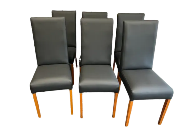 Dining chair drop-in seat being recovered on an upholstery workbench