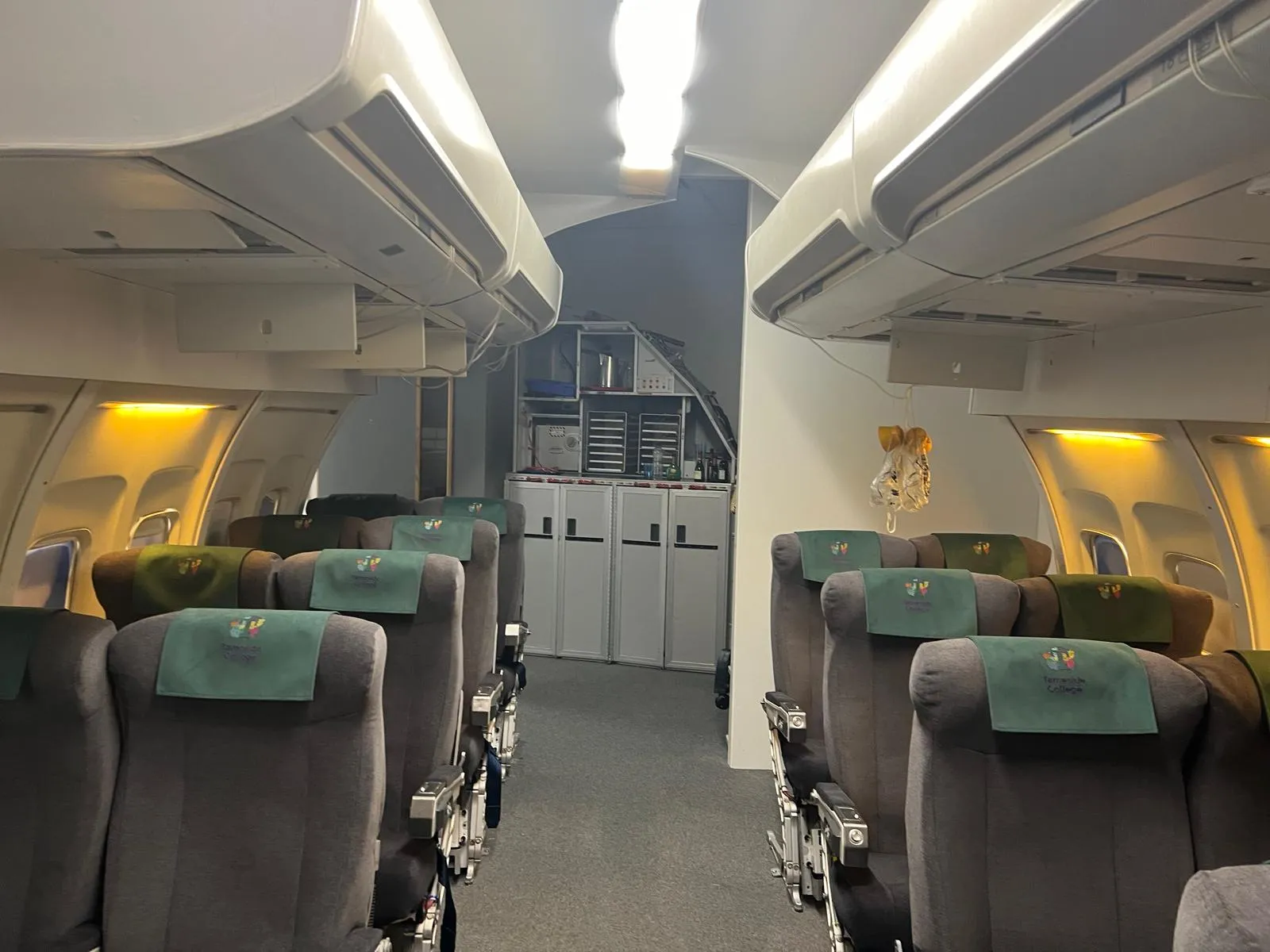 Finished Tameside College cabin crew training cabin with recovered seats and embroidered antimacassars