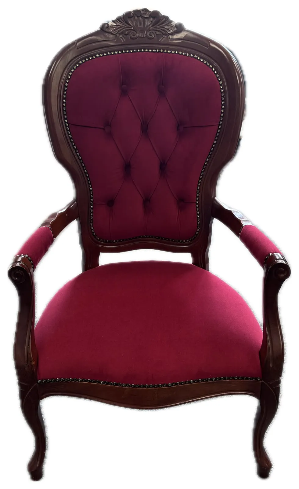 Victorian-style mahogany armchair recovered in deep burgundy buttoned fabric with brass nail trim