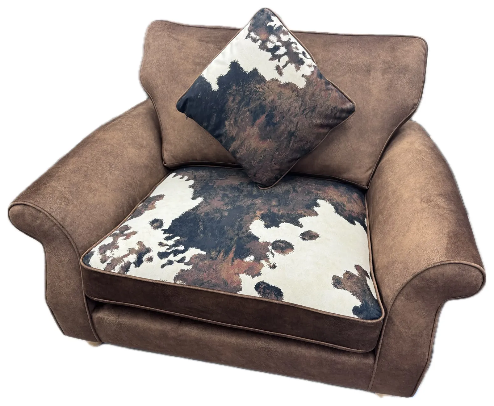 Love chair recovered in brown suede-look fabric with cowhide-print seat cushion and matching scatter