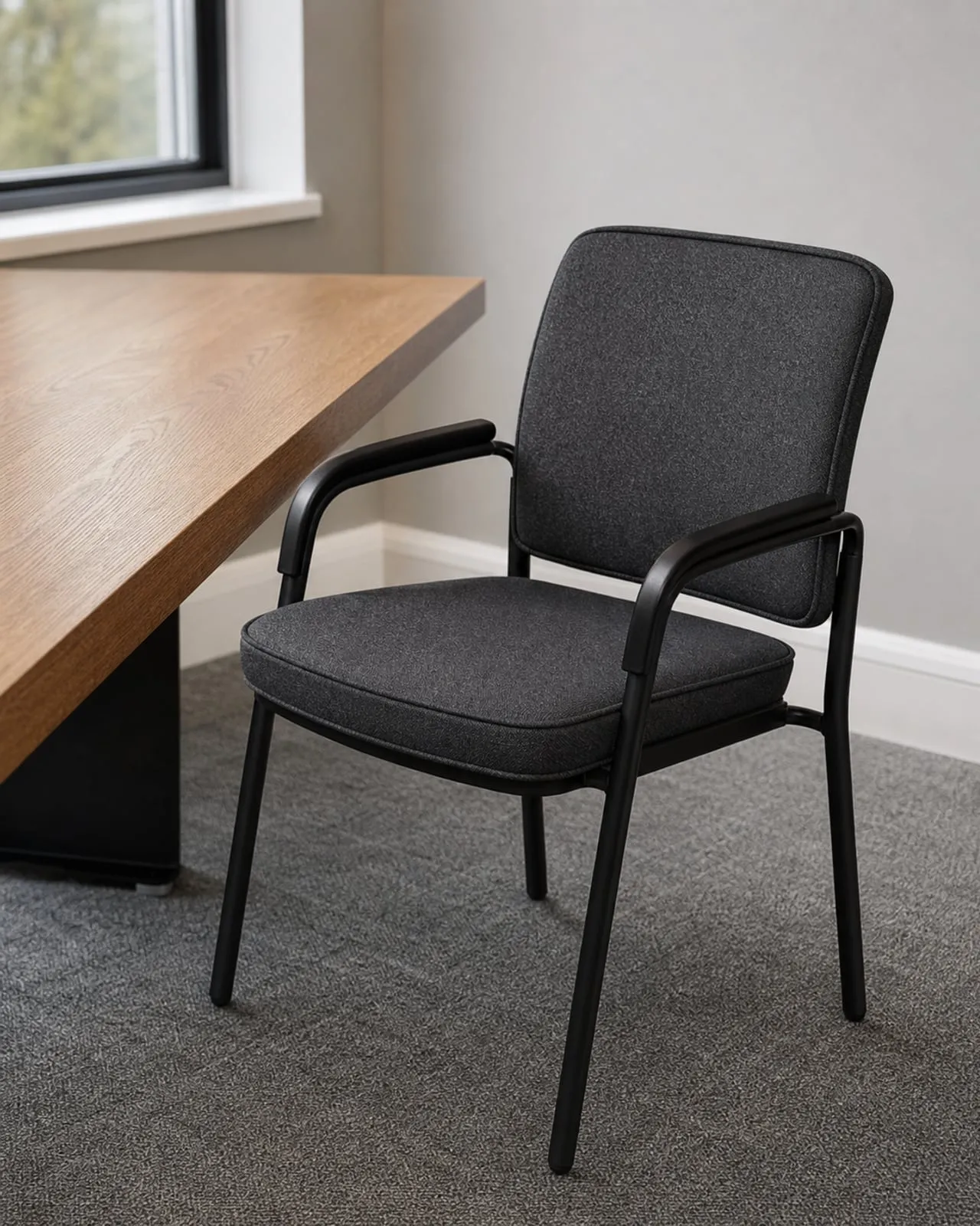 Office meeting room chair reupholstered in charcoal contract fabric