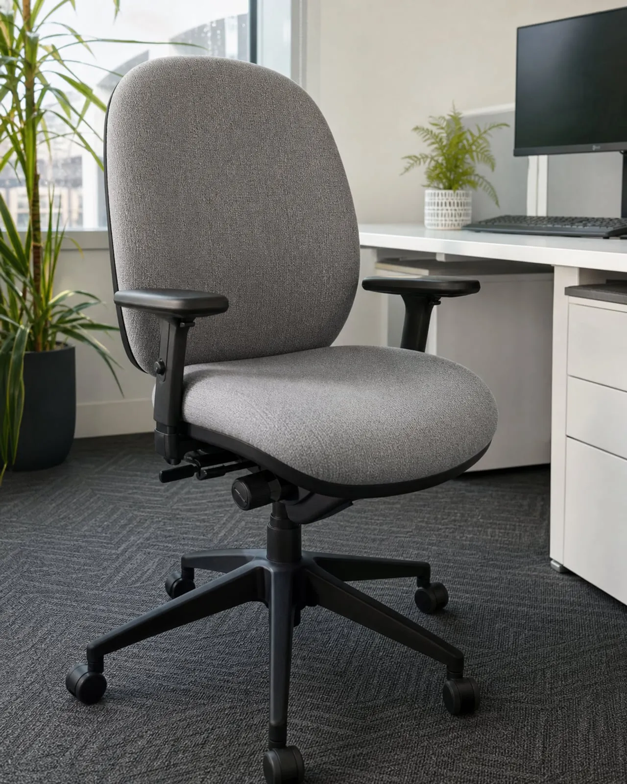 Office task chair reupholstered in neutral grey contract fabric