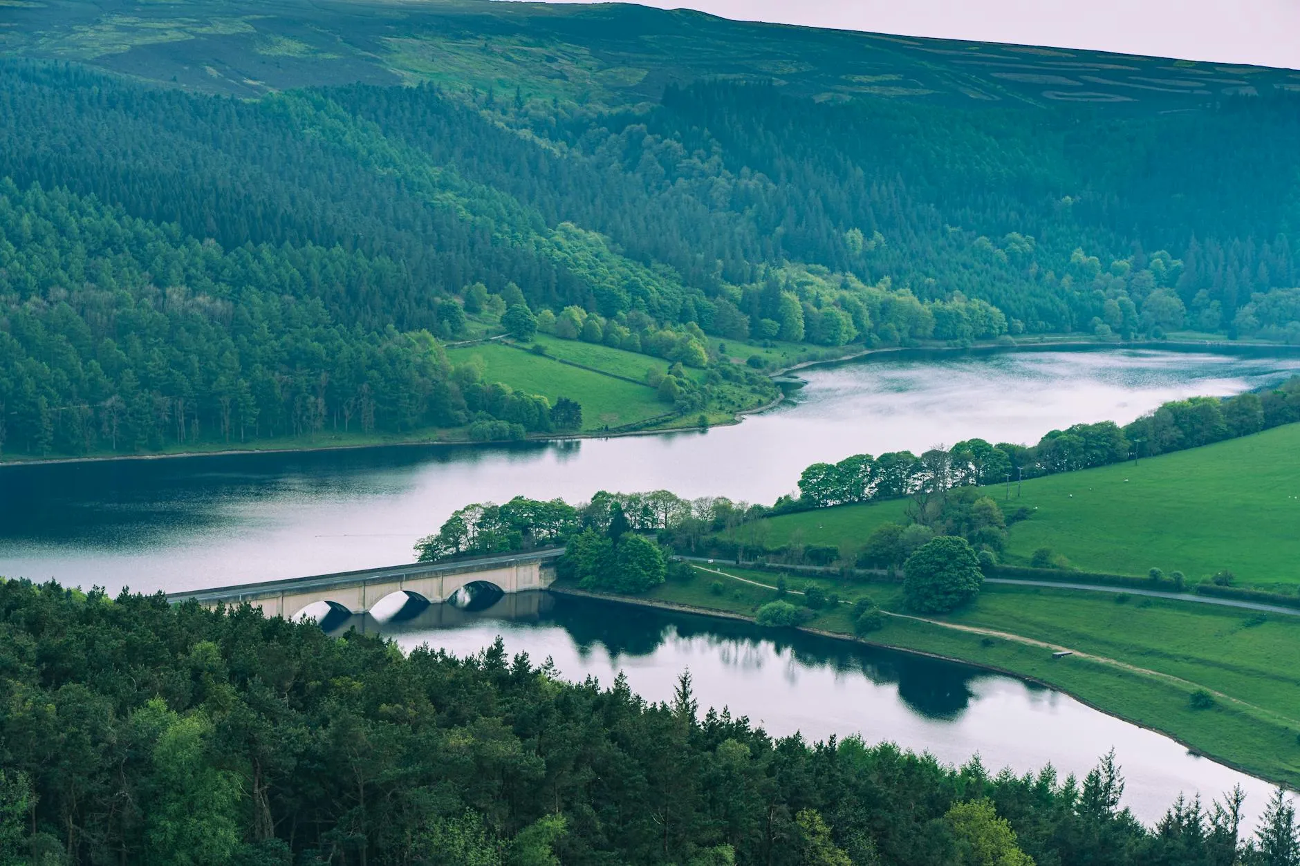 Aerial view of Ladybower Reservoir and surrounding landscape in England during summer. — covered by Valley Upholstery's Stalybridge route