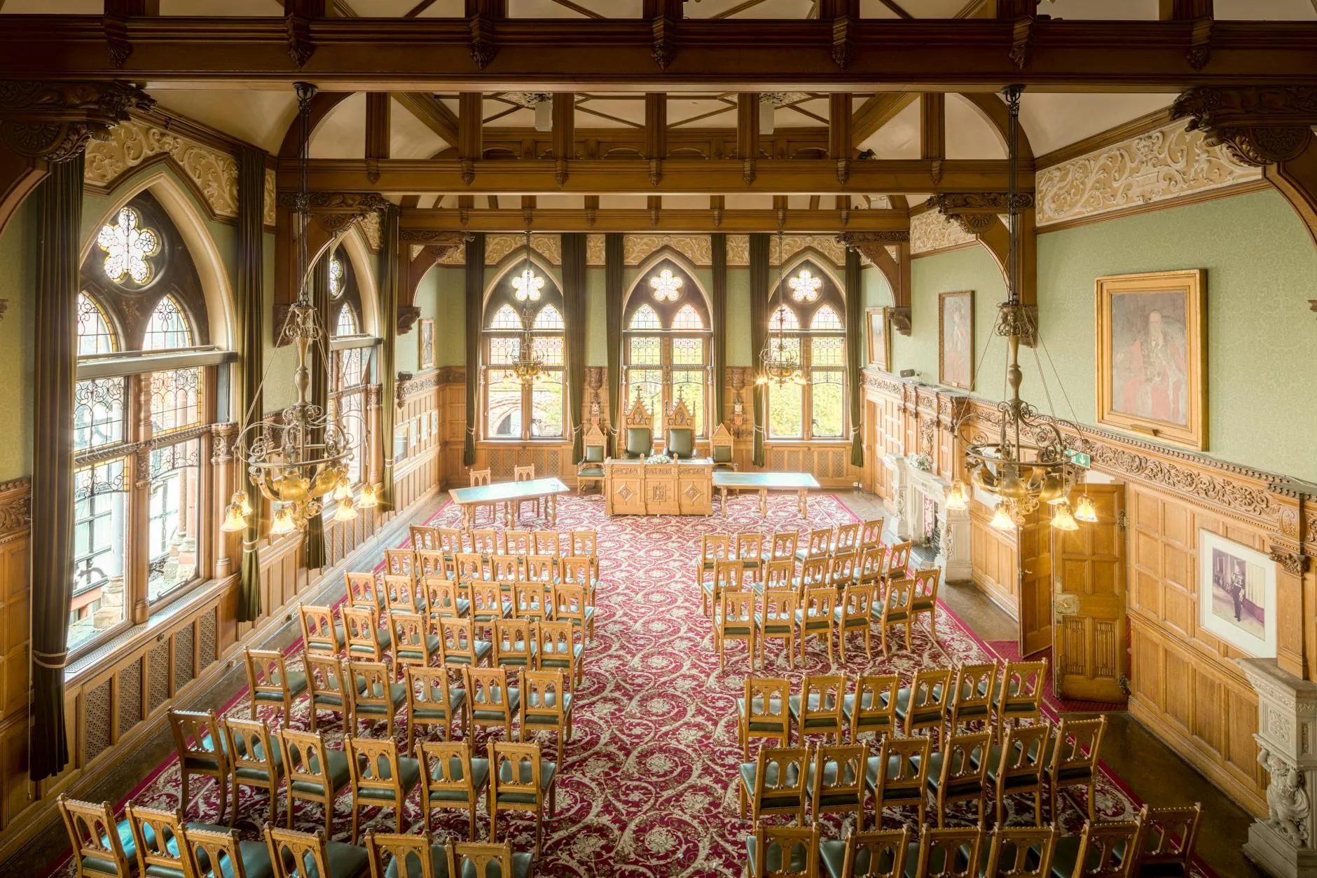 A beautifully ornate town hall interior featuring vintage woodwork and impressive Gothic architecture. — covered by Valley Upholstery's Stalybridge route