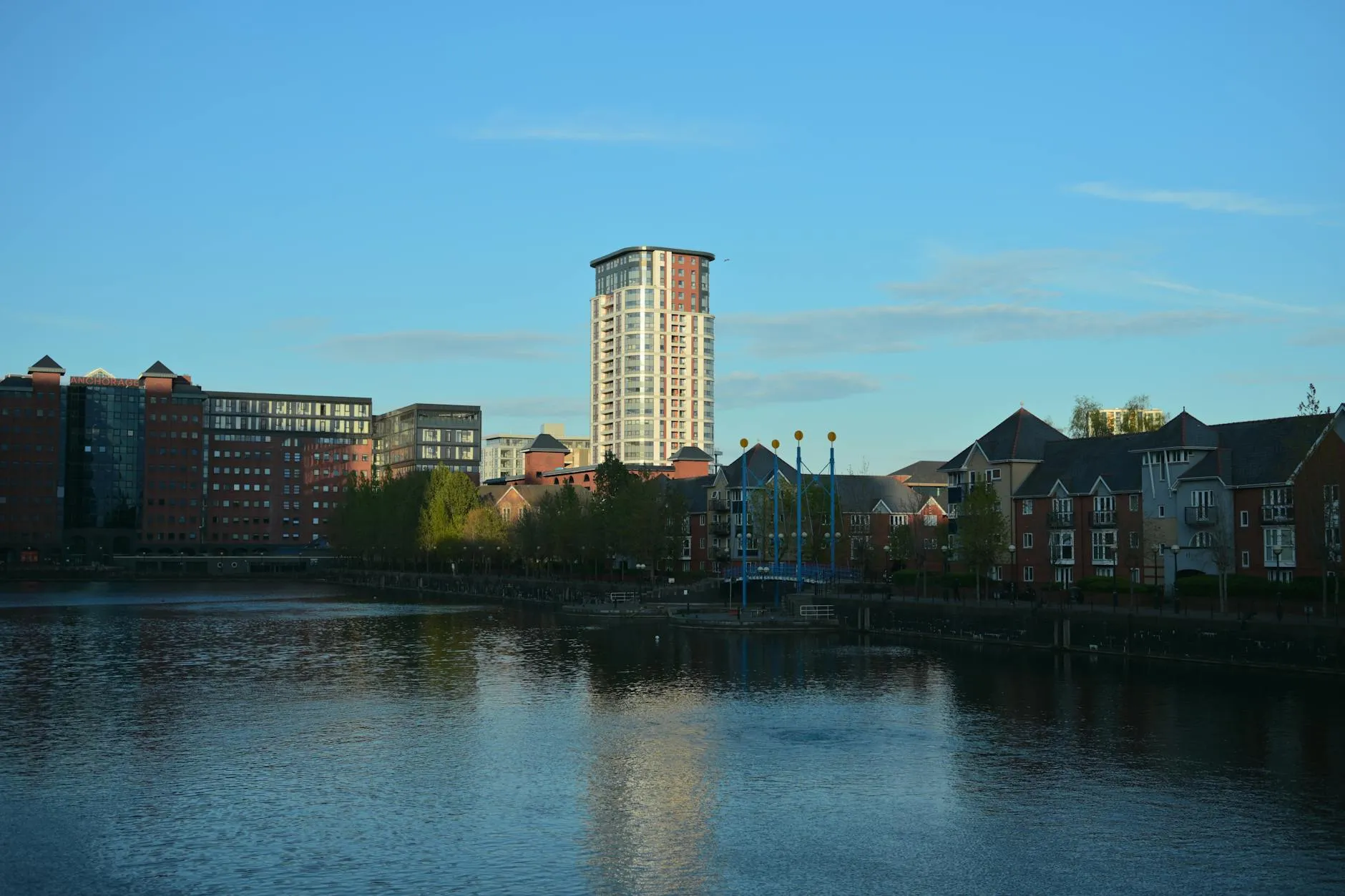 Beautiful urban landscape featuring modern architecture along a serene waterfront at sunset. — covered by Valley Upholstery's Stalybridge route