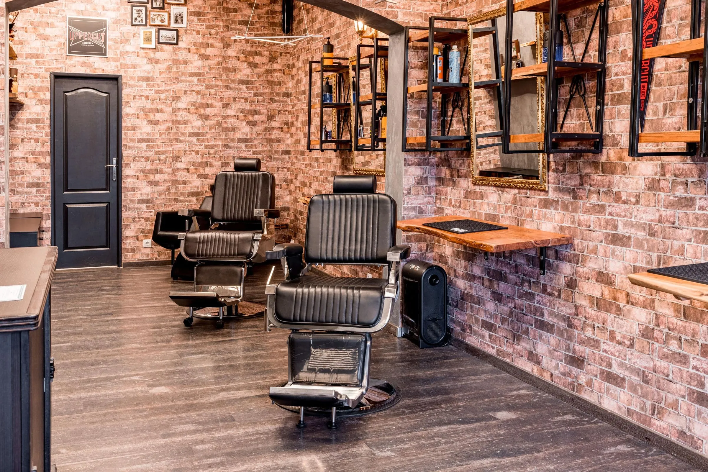 Representative barber shop with two black leather hydraulic barber chairs
