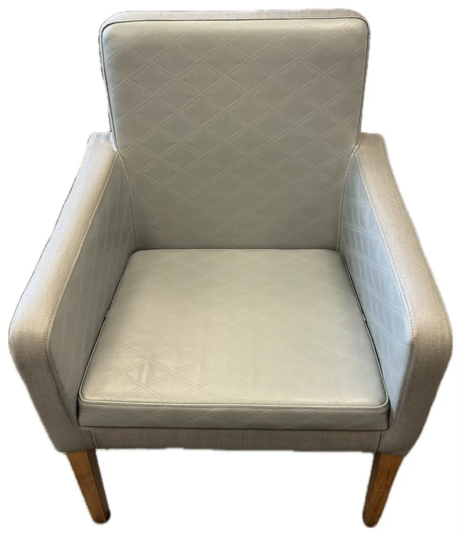 Hotel dining armchair recovered in grey diamond-quilted faux leather