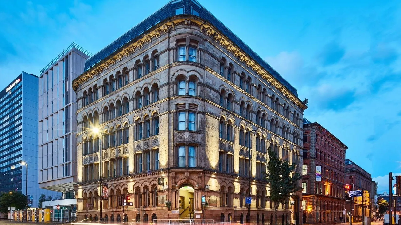 The Townhouse hotel, Manchester -- Victorian stone corner building lit at dusk